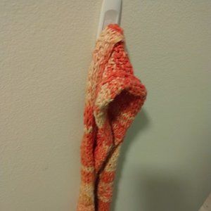 Orange-creamsicle coloured knit scarf